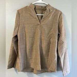 Tan Blouse with buttons down the back. Buttons on both arms to roll sleeves up